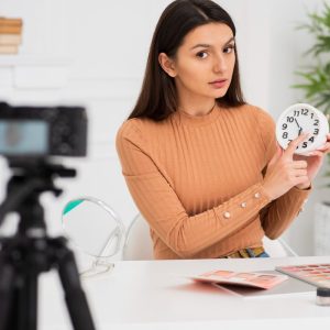 cute-woman-presenting-clock (1) cute-woman-presenting-clock (1)