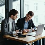 two-young-businessman-having-successful-meeting-restaurant (1)