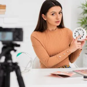 cute-woman-presenting-clock (1)