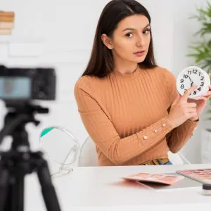 cute-woman-presenting-clock (1)